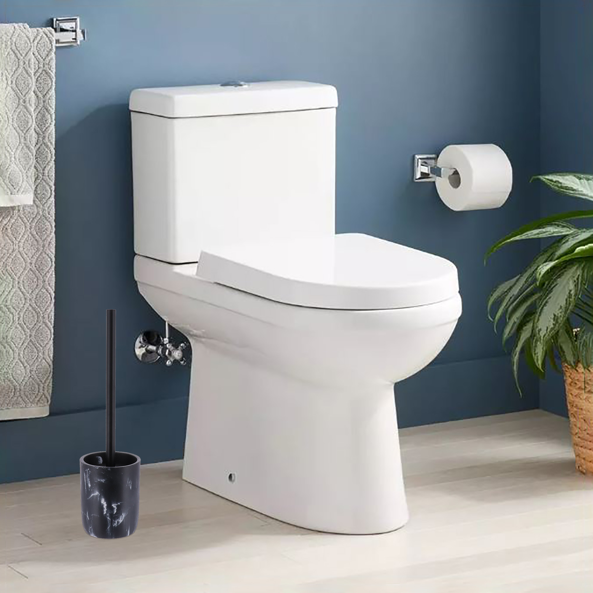 Black marble toilet brush holder next to modern toilet