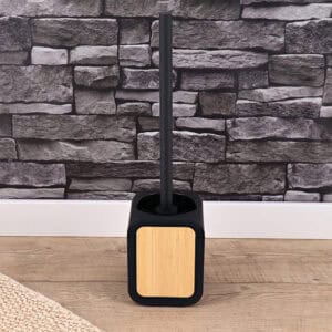 Black and bamboo toilet brush set displayed in a modern bathroom