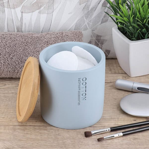 Open cotton holder with pads and lid off