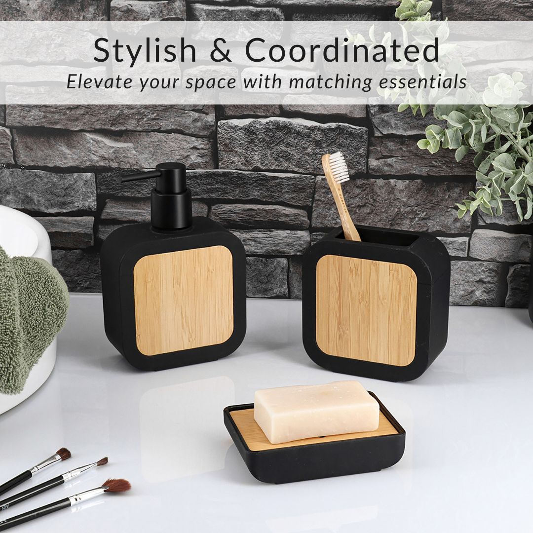 Matching soap dispenser, toothbrush holder, soap dish, and toilet brush in black rubber and natural bamboo wood design
