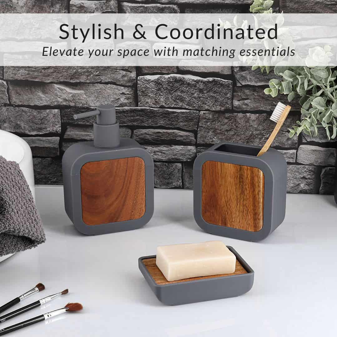 Matching soap dispenser, toothbrush holder, soap dish, and toilet brush in gray rubber and natural acacia wood design