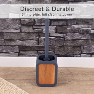 Discreet toilet brush with acacia wood insert displayed on wood floor and stone wall background