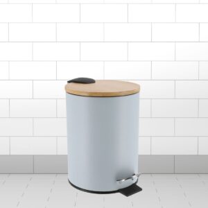 Light blue bathroom trash can with bamboo lid and foot pedal shown in tiled room