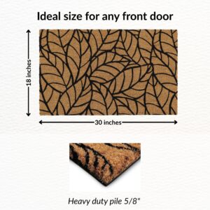Coir mat with bold black leaf pattern for indoor and outdoor use, enhances entryway
