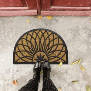 Top view of petal doormat at entrance with person standing on it