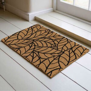 Coir doormat featuring a bold black leaf design, a modern accent for any doorway