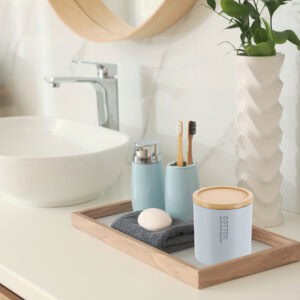 Cotton box on vanity with soap and tumbler