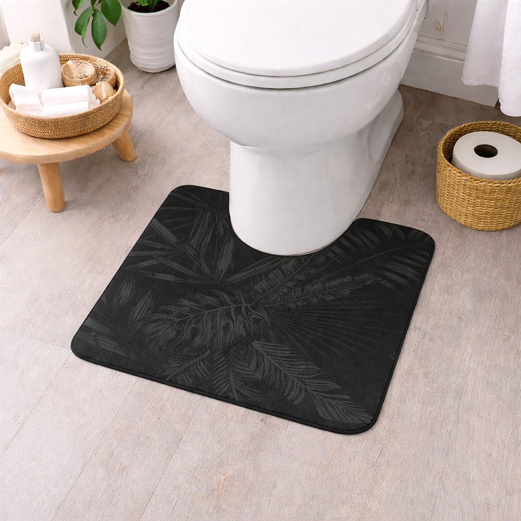 Black contour bath mat with tonal palm frond design