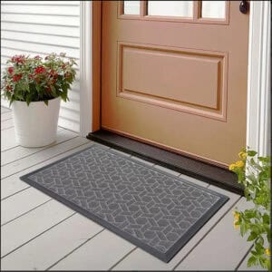 Gray geometric doormat placed at front door on porch