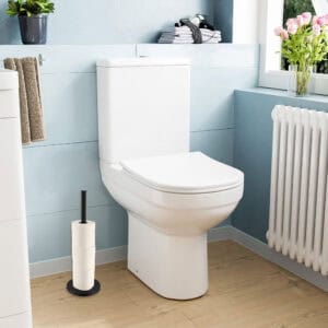 Toilet paper holder placed beside a toilet in a bright, modern bathroom