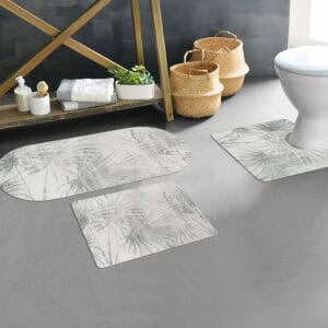 Palm Breeze bath mat set with runner, contour, and standard mat displayed in modern bathroom with gray flooring