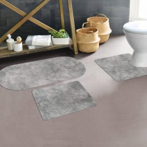 Urban Concrete mats shown in minimalist bathroom setting with neutral décor around bath, toilet, and sink