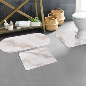 Marble Vein bath mat trio styled in bathroom space, showcasing clean marble aesthetic around tub, sink, and toilet
