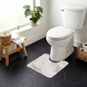 Marble Vein contour mat styled around toilet in bright bathroom with monstera plant and wicker accents