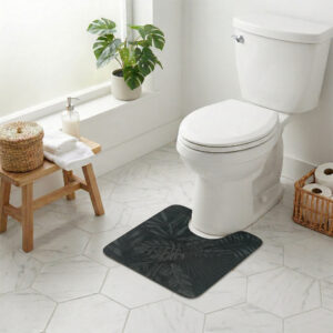Tropical Night contour mat styled around toilet in bright bathroom with monstera plant and wicker accents