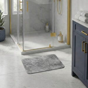 Urban Concrete bath mat in modern bathroom with glass shower and navy vanity