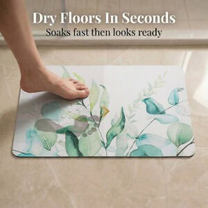 Foot stepping on Eucalyptus Mist bath mat showing "Dry Floors In Seconds" with water droplets