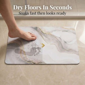 Foot stepping on Marble Vein bath mat showing "Dry Floors In Seconds" with water droplets
