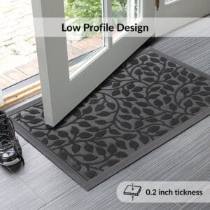 Low profile black doormat under open glass door – 0.2 inch thick