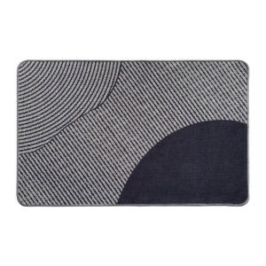 Top view of a geometric gray and black kitchen mat with curved and striped patterns