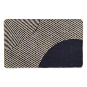 Top view of a geometric beige and black kitchen mat with curved and striped patterns