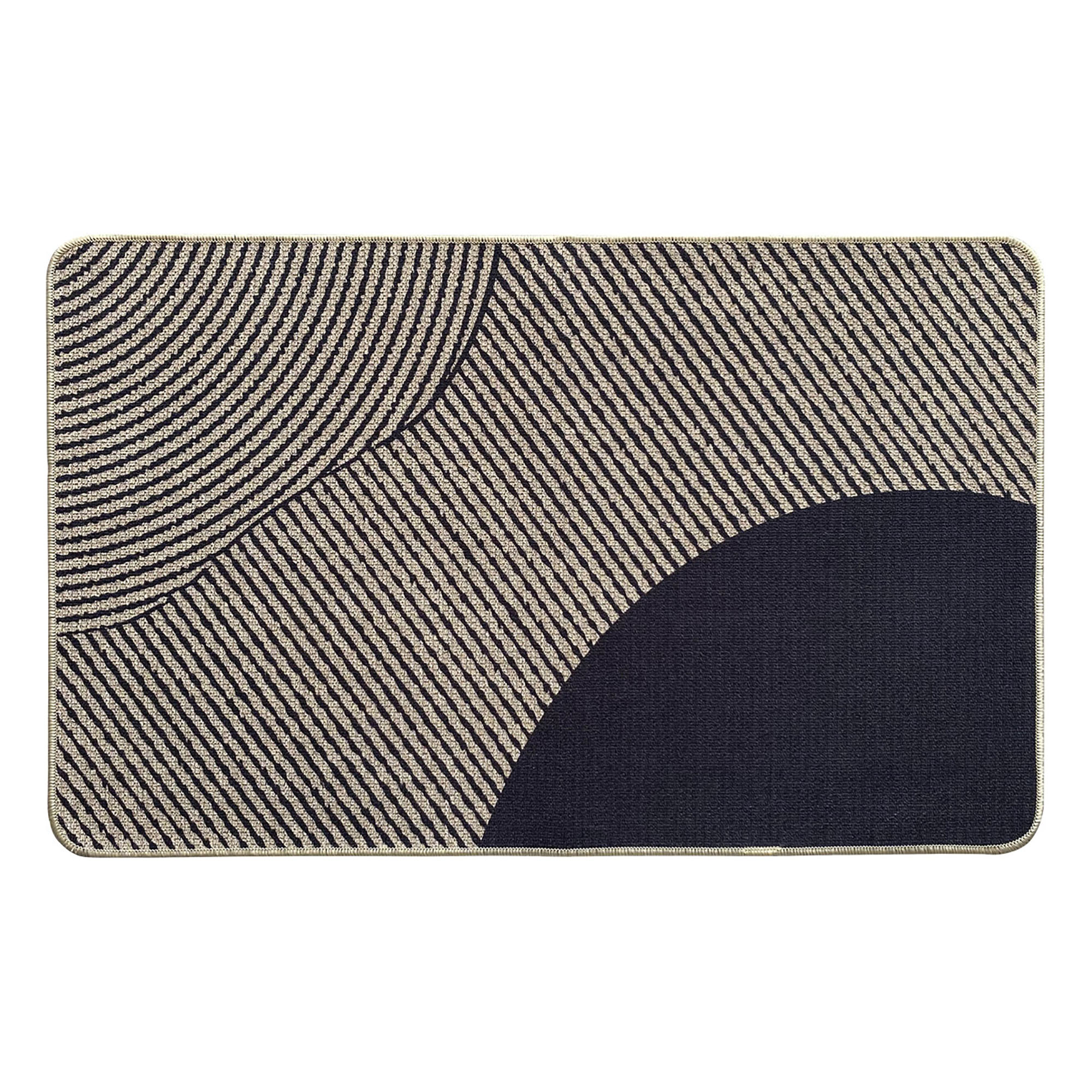 Top view of a geometric beige and black kitchen mat with curved and striped patterns