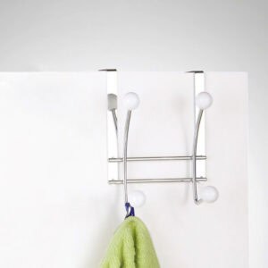 Hook rack on white door holding green towel usage example
