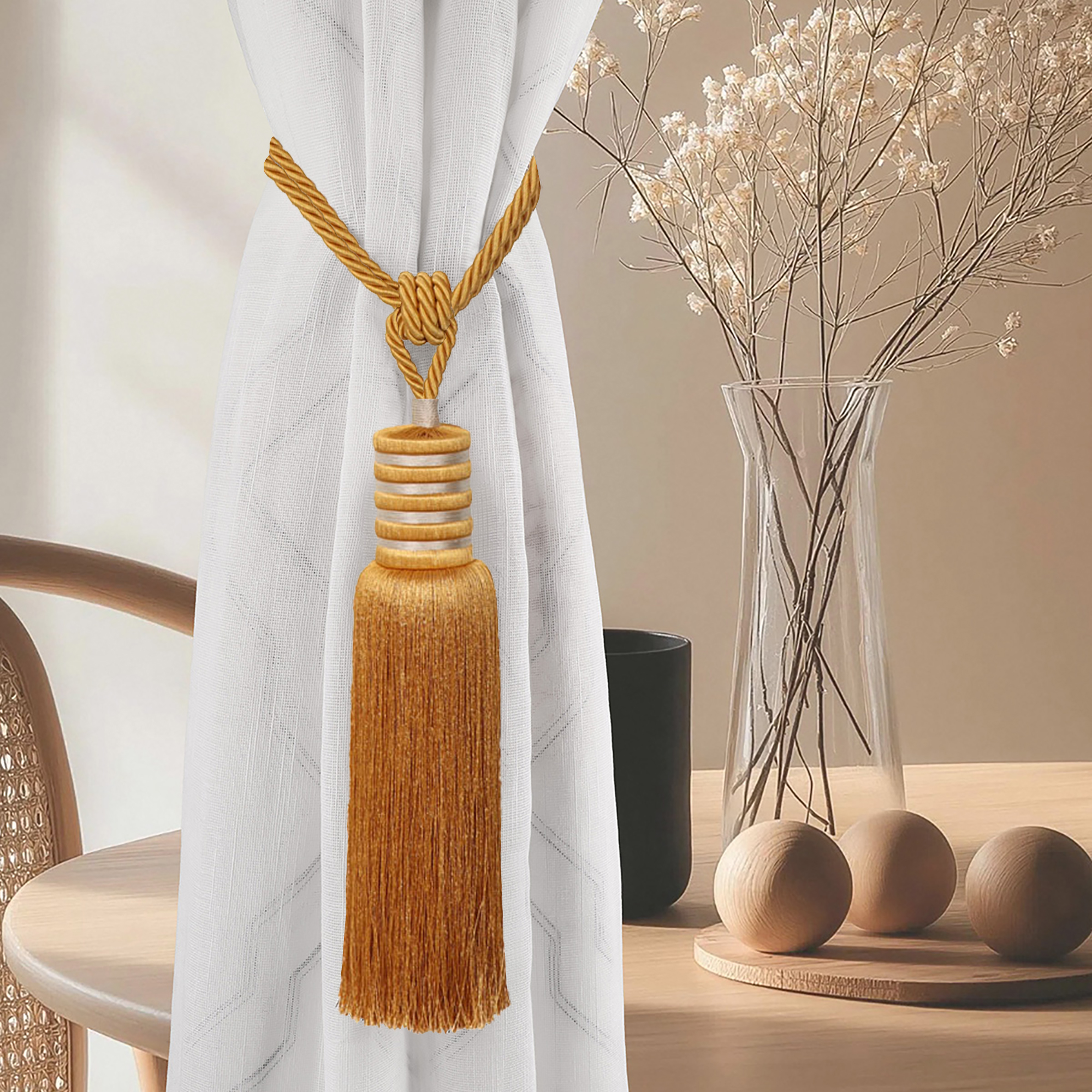 Golden amber curtain tieback elegantly styled on white curtain in modern interior with wood decor and vase