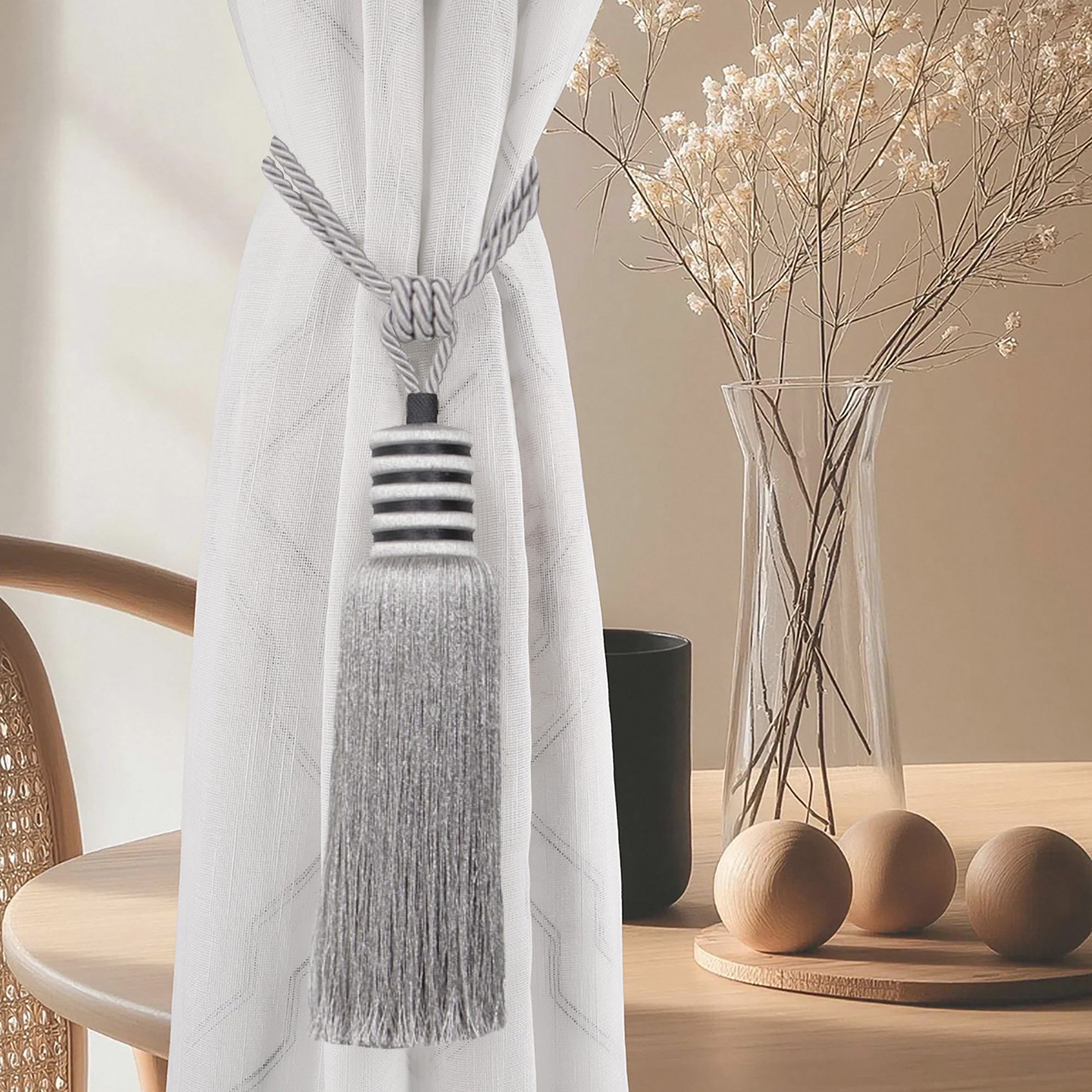 Silver mist tieback styled on curtain in neutral-toned interior, highlighting soft shimmer and clean contrast