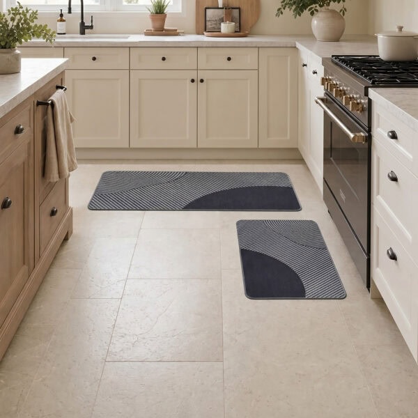 Gray kitchen mat and runner set arranged on tile flooring in a modern farmhouse kitchen, coordinating pieces that frame sink and stove.