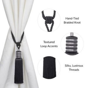 Close-up of midnight black curtain tieback with hand-braided knot, loop detail, and flowing silky tassel