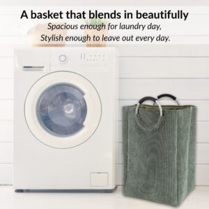 Laundry basket beside washing machine in minimalist setup