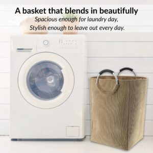 Laundry basket in sand beige beside washer in minimalist setup