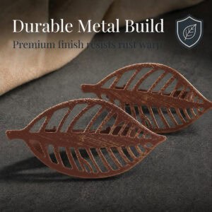 Two rustic brown metal leaf curtain tiebacks shown close up on dark fabric