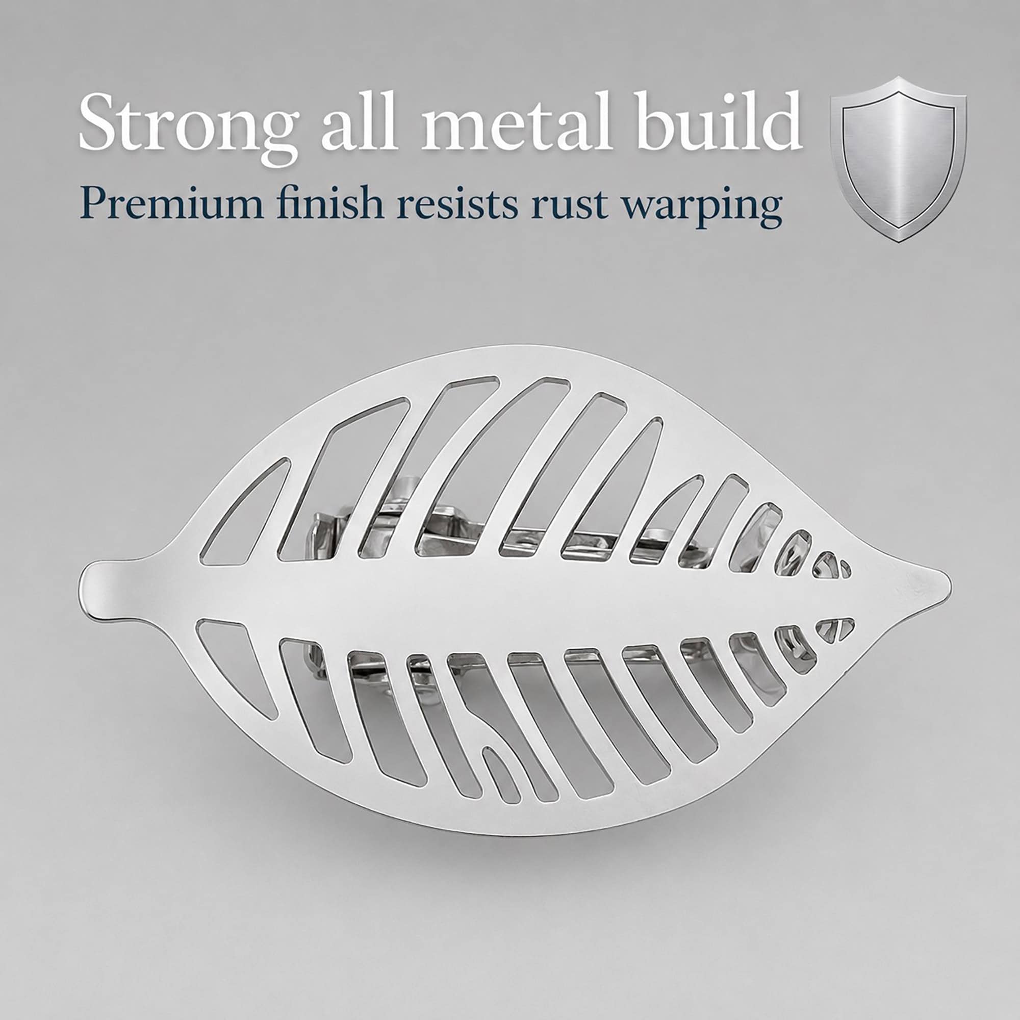 Polished silver leaf curtain tieback shown close up with all metal build