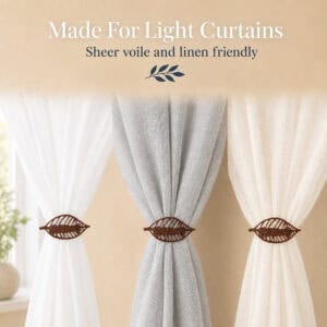 Rustic brown leaf curtain tiebacks on white, gray, and ivory sheer panels