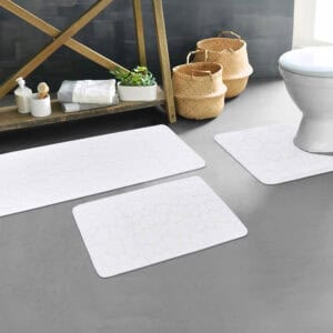 White pebble bathroom mat set styled in modern bathroom décor