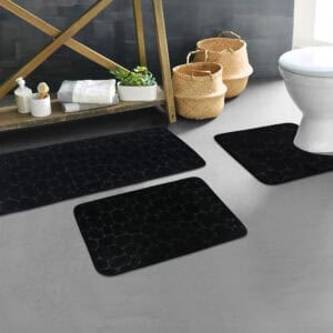 Black pebble bathroom mat set styled in modern bathroom décor