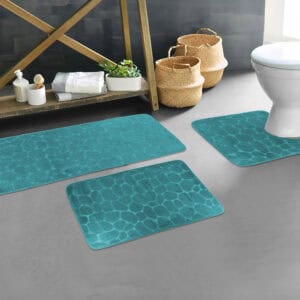 Peacock blue pebble bathroom mat set styled in modern bathroom décor