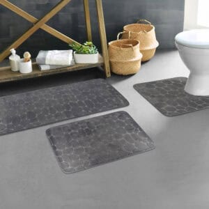 Dark gray pebble bathroom mat set styled in modern bathroom décor
