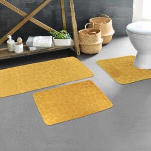 Mustard yellow pebble bathroom mat set styled in modern bathroom décor