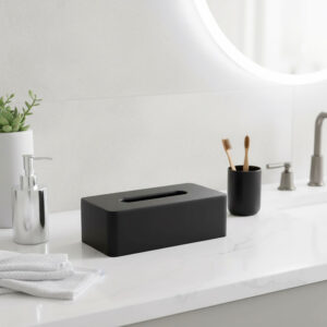 Black tissue box holder on bathroom counter