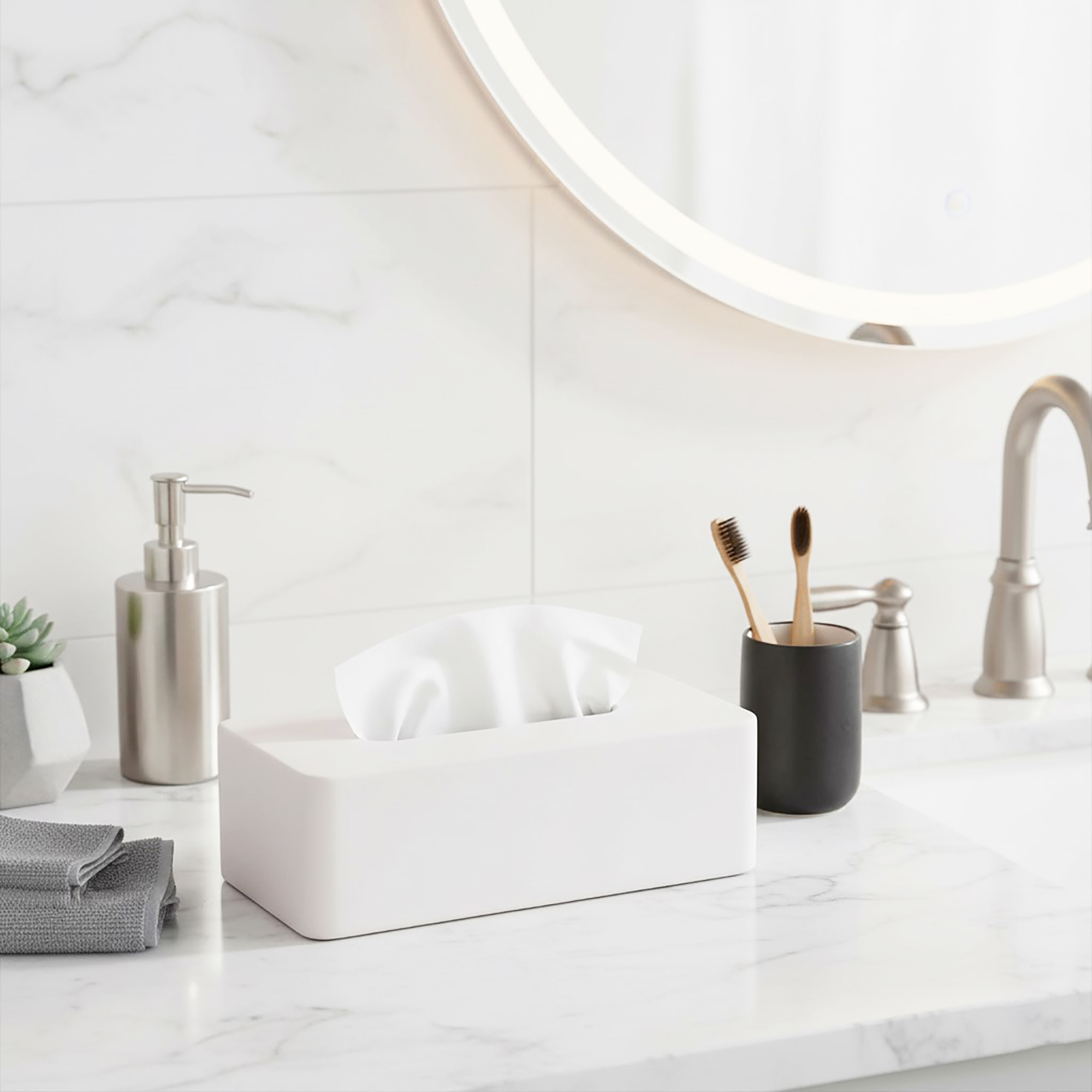 Beige tissue box holder on bathroom counter