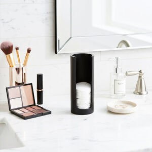 Black cotton pad holder on bathroom counter
