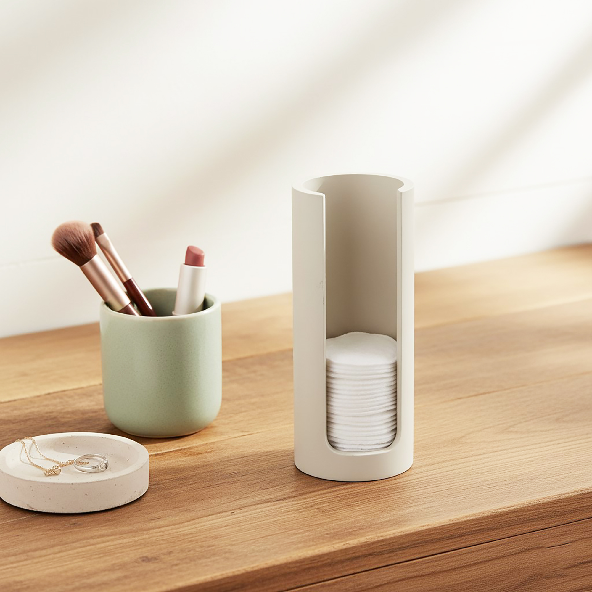 Beige cotton pad holder on bathroom counter