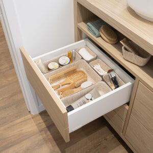 Beige felt organizers used inside bathroom drawer with beauty items