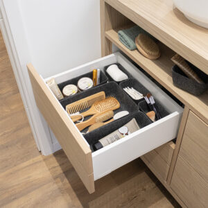 Gray felt organizers used inside bathroom drawer with beauty items