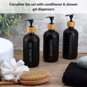 Black shampoo conditioner shower gel dispenser set on countertop