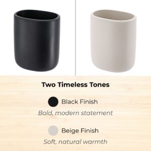 Beige and black bathroom tumblers side by side