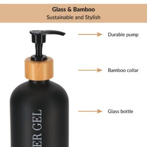 Close-up of black glass shower gel bottle with bamboo collar and pump